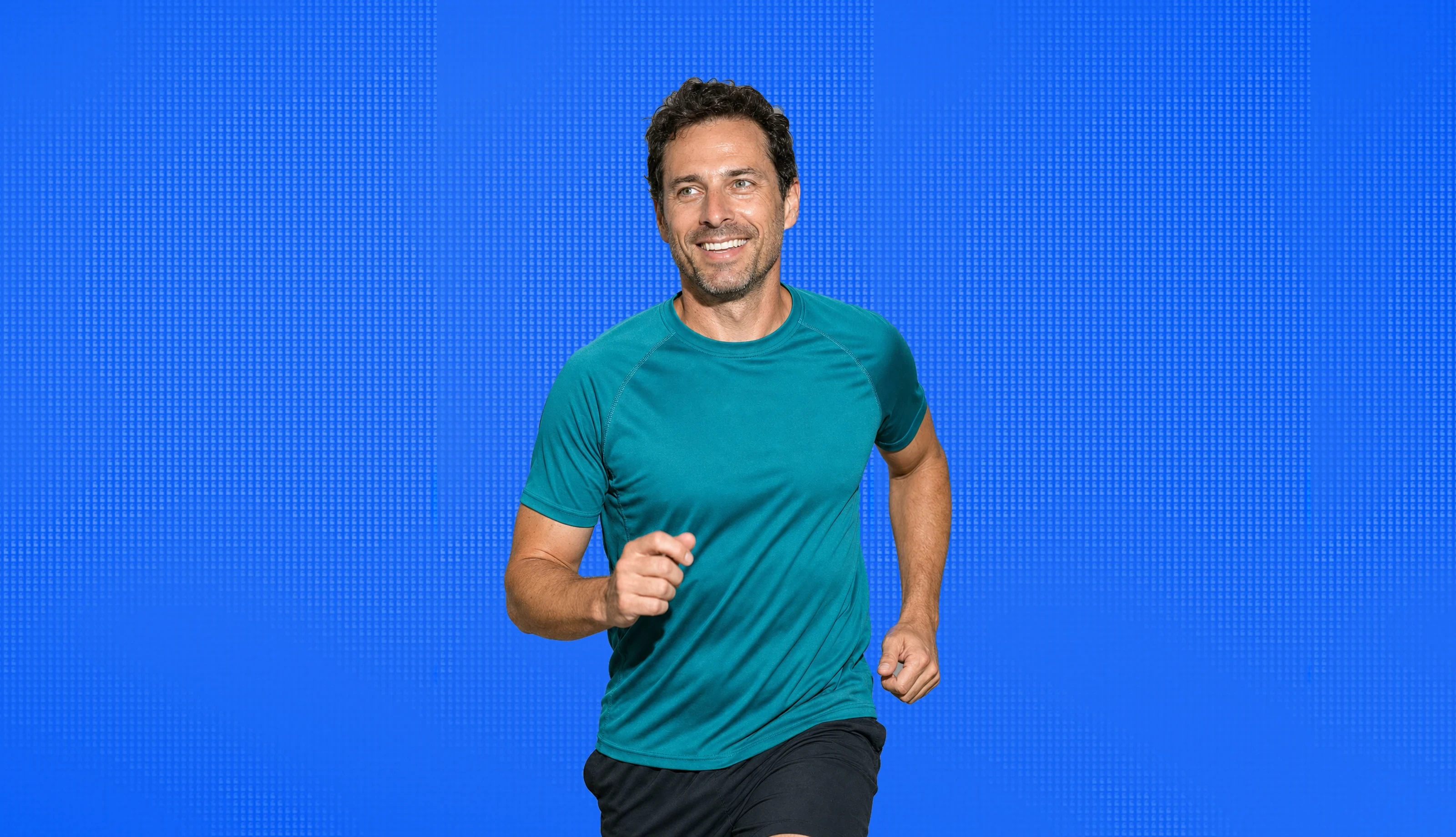 A man in his forties out running, mid stride