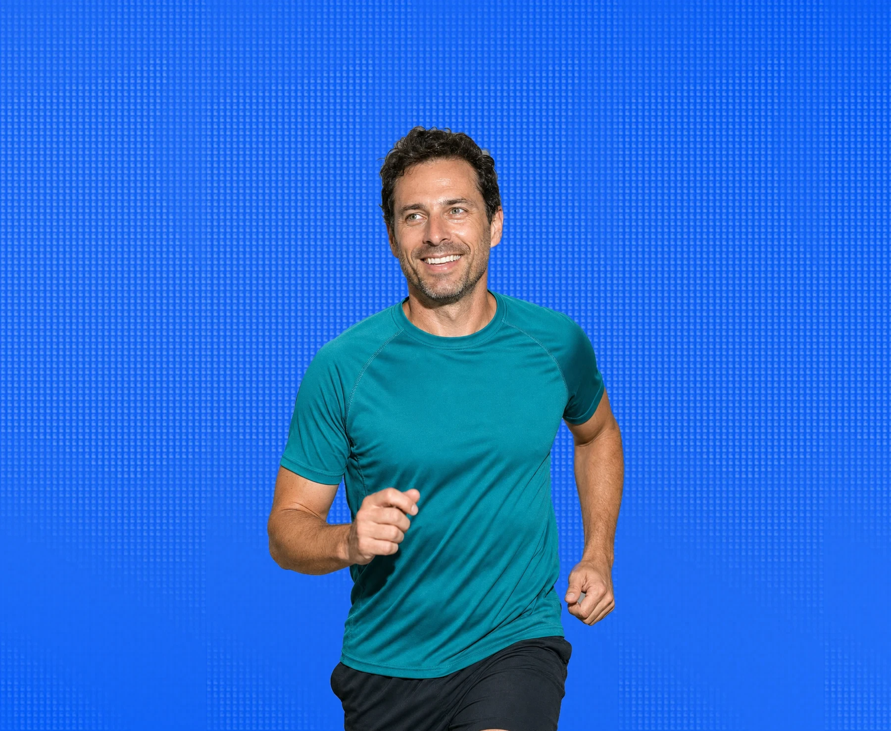 A man in his forties out running, mid stride