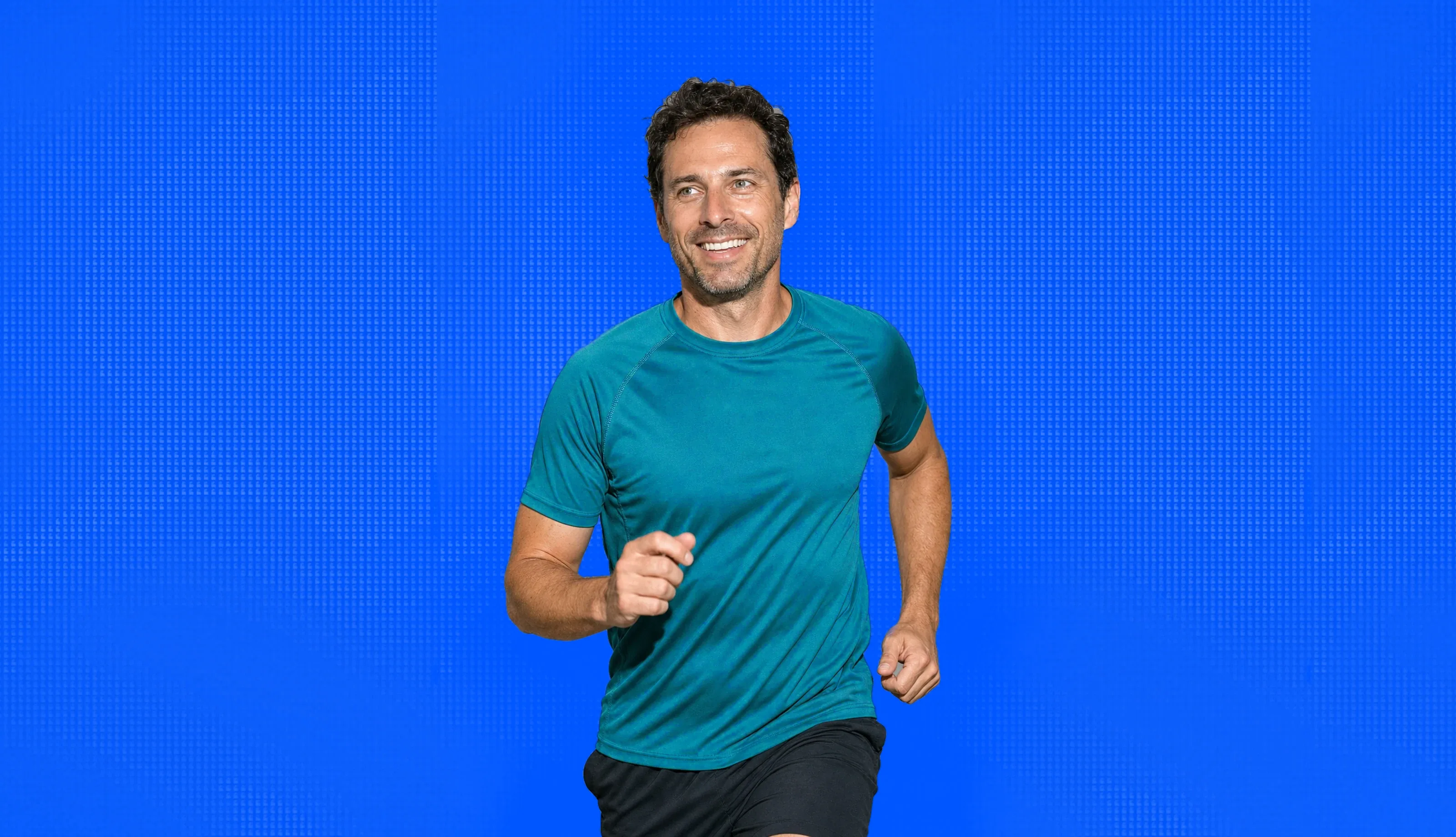 A man in his forties out running, mid stride