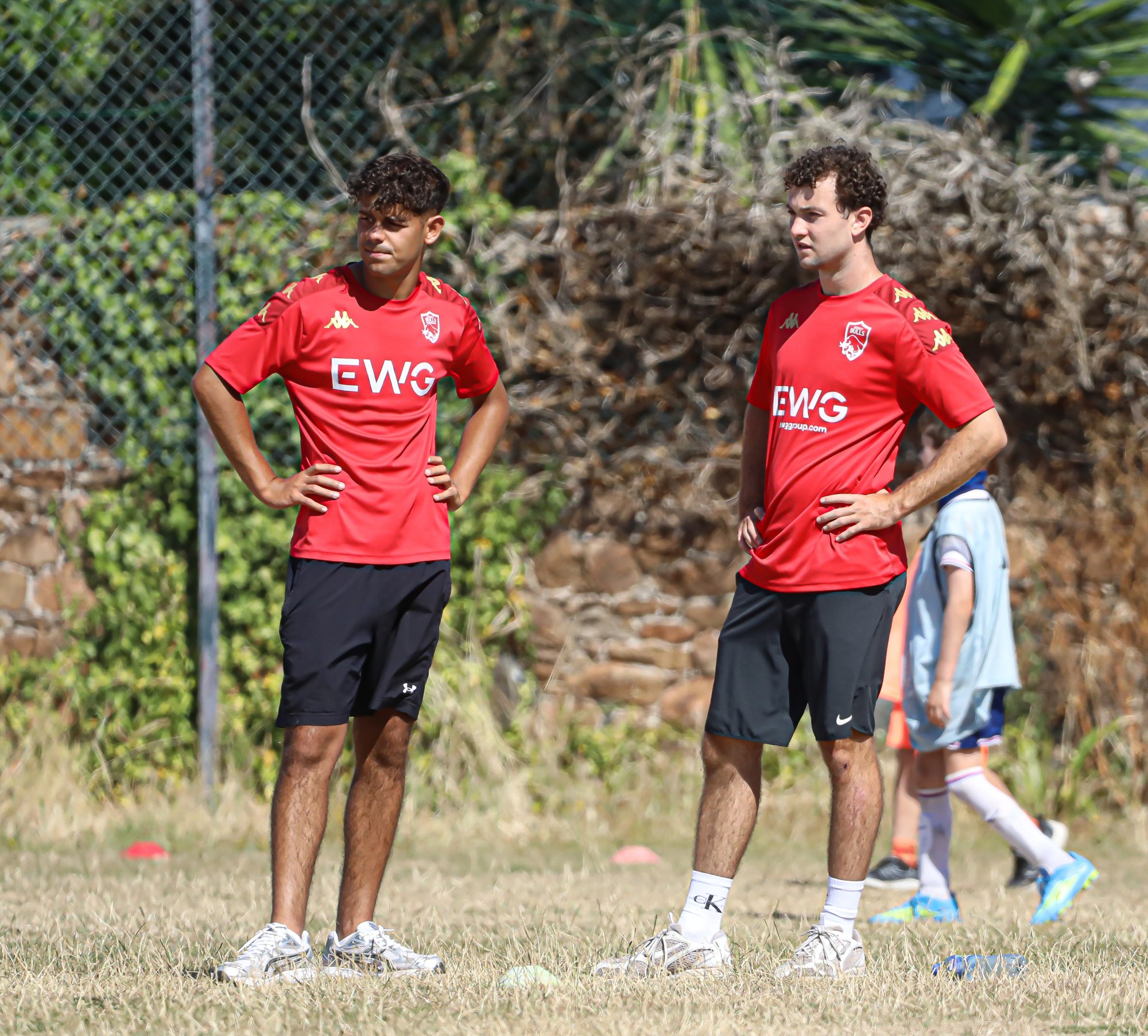 Sports Bug and Jersey Bulls coaches on the pitch