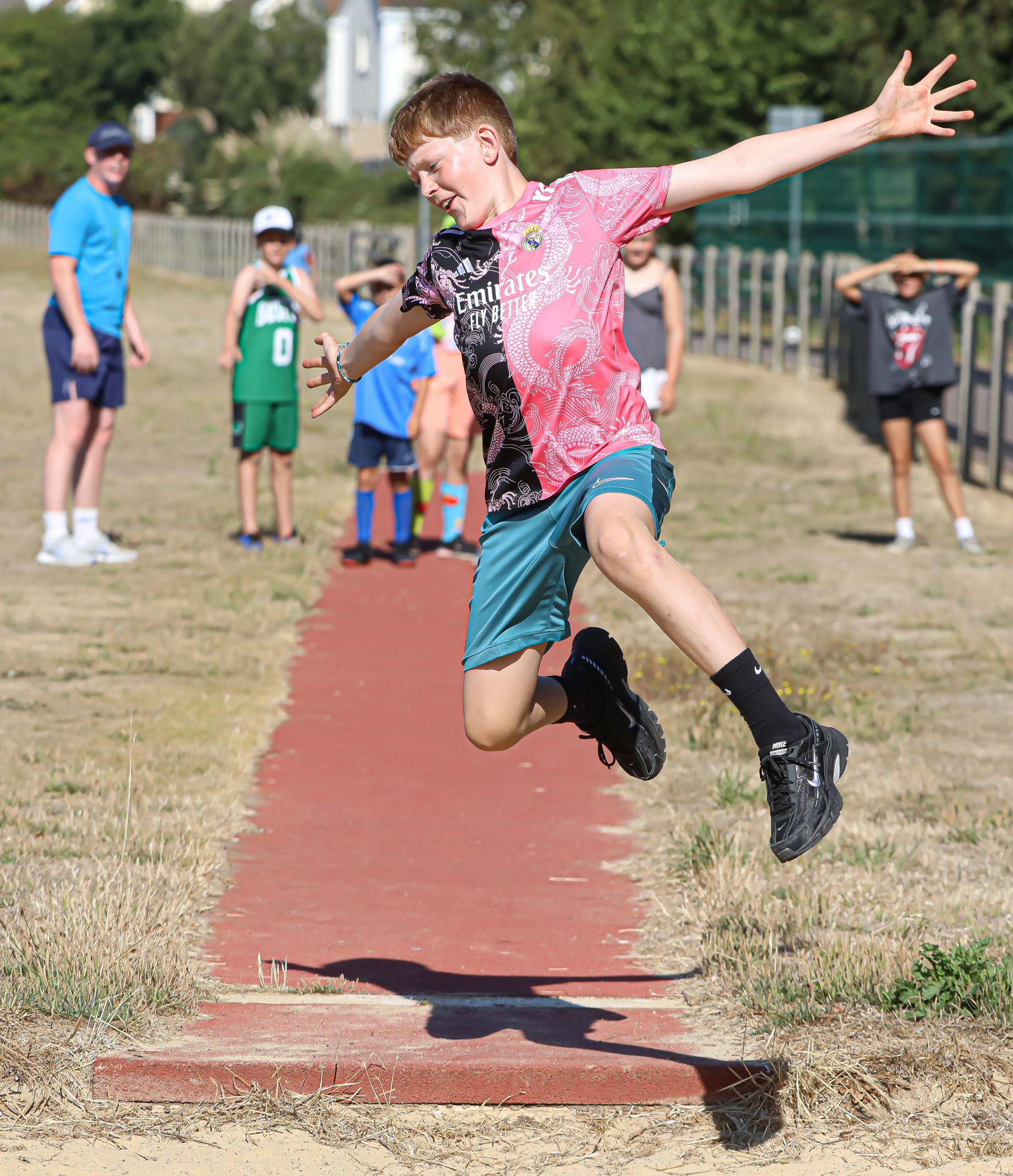A child taking part in long jump at Sports Bug