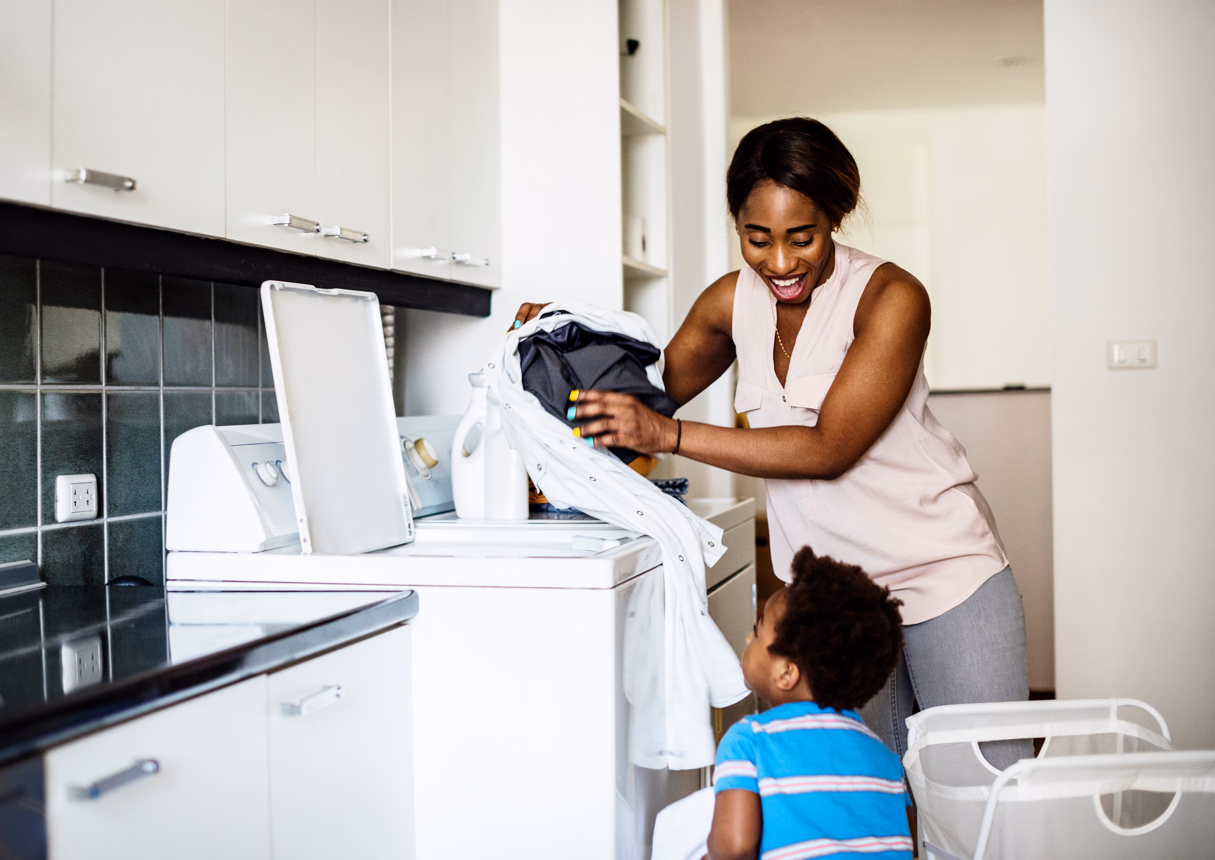Family Doing Laundry Stock Image