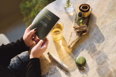 a woman reading a Goodweigh manual