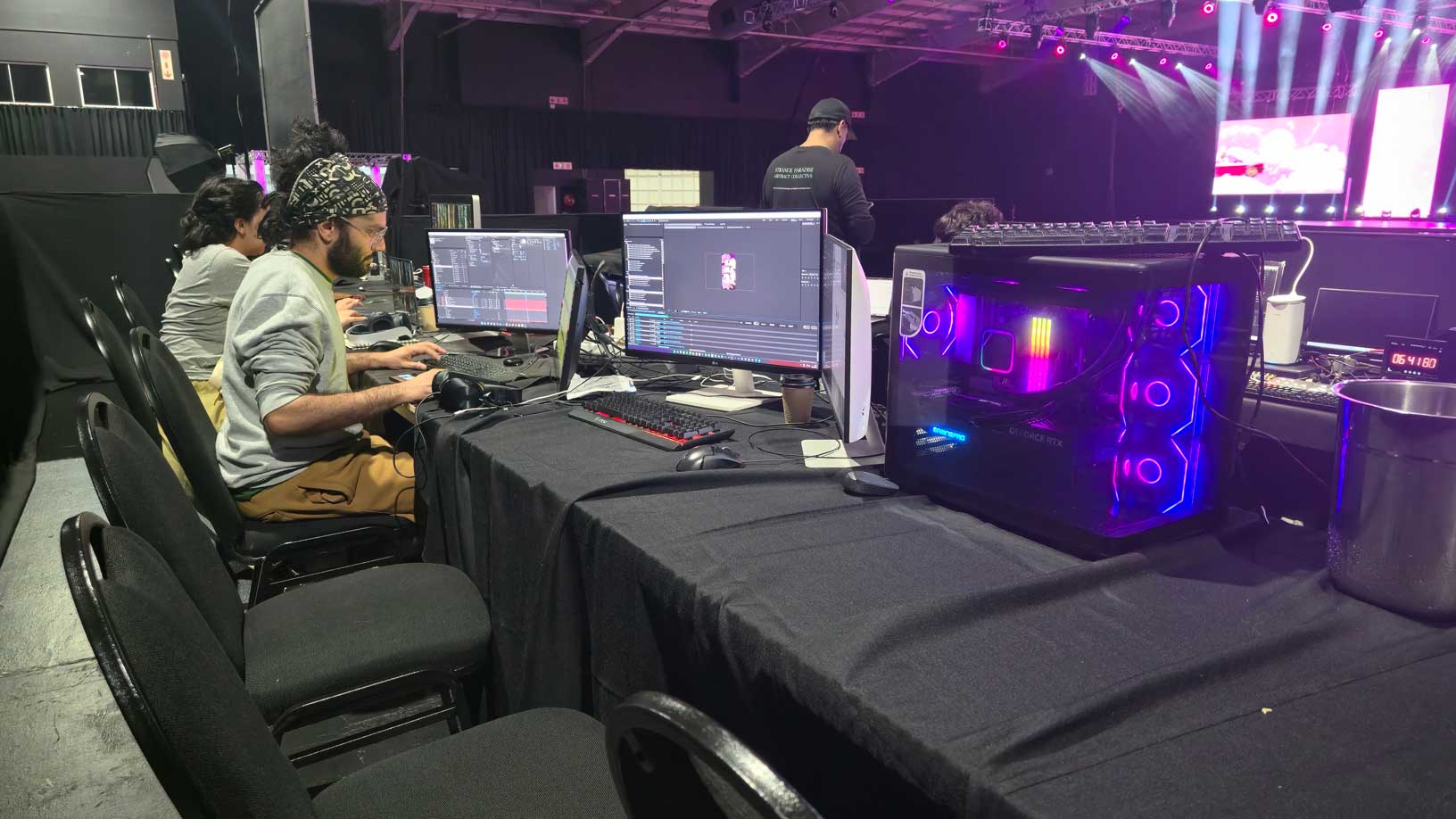 Production crew working at a live event editing desk