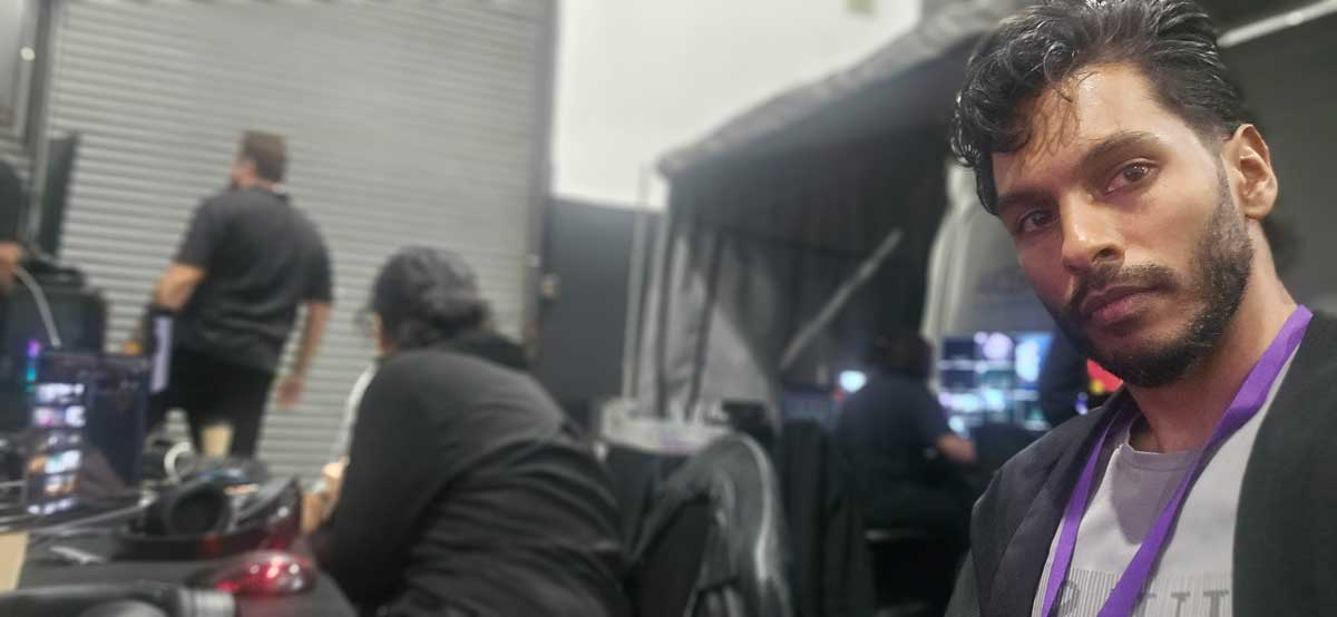 Colleague working backstage with a production team