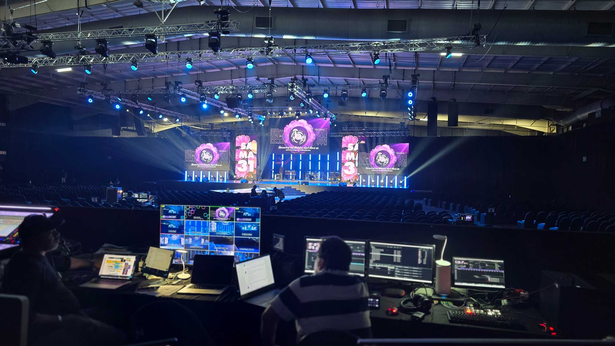 Production control area overlooking a stage during a live event