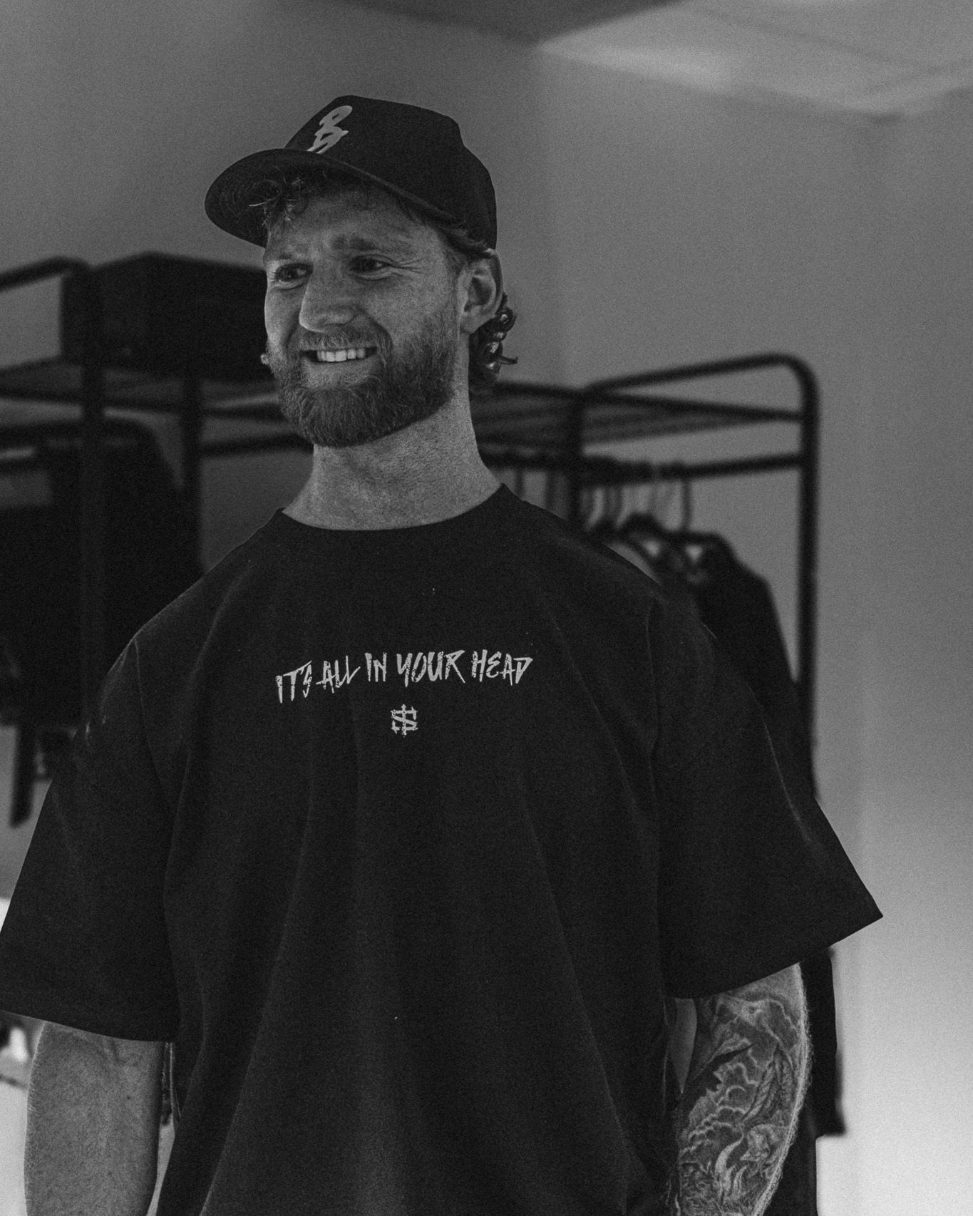 Ben Leonard, founder of BL Motion Media, in a cap and black tee, black and white portrait