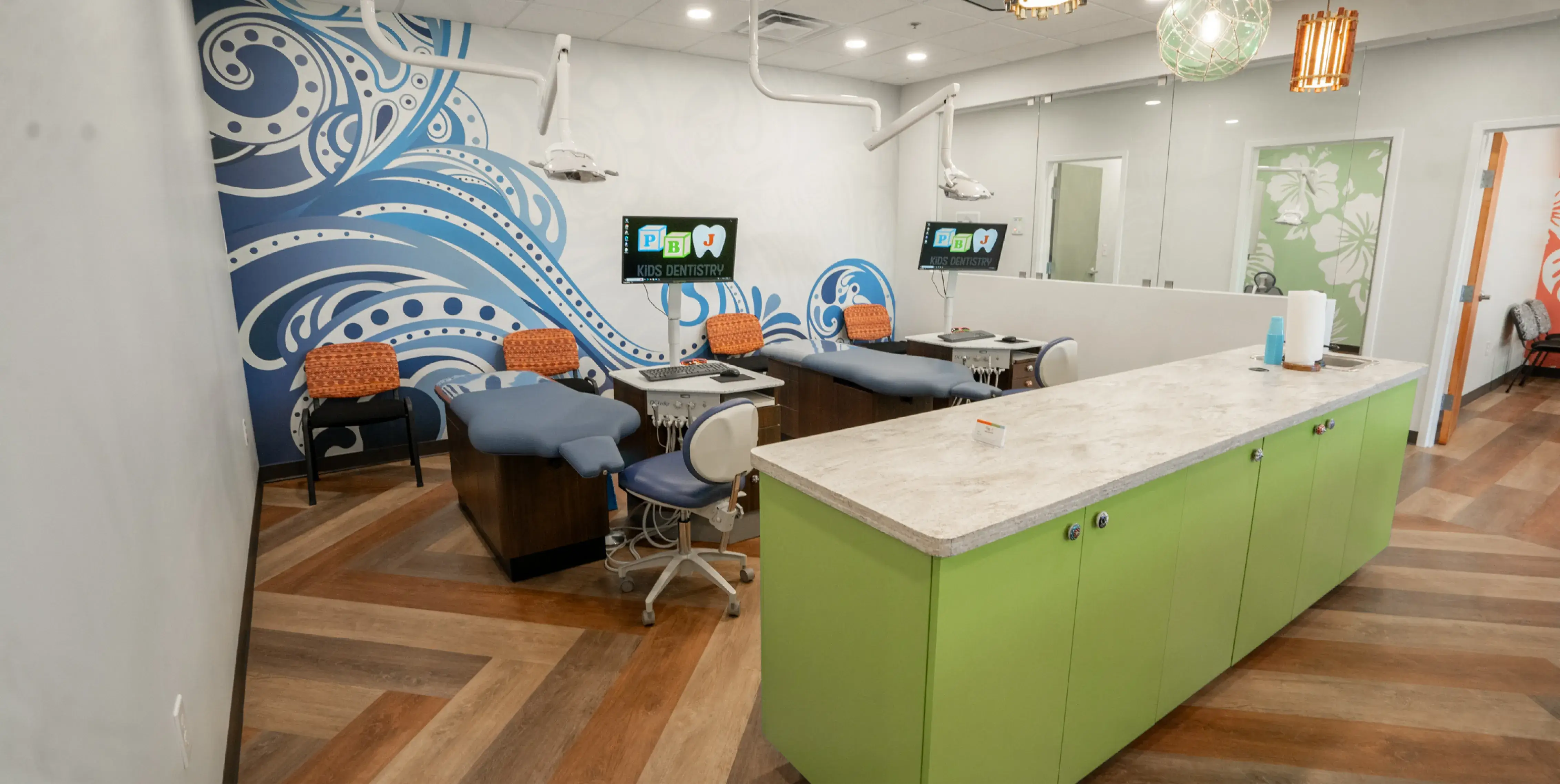 A dentist office with chairs and a counter.