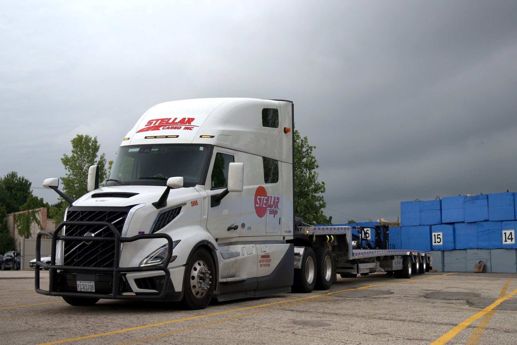 Stellar Cargo open-deck flatbed tractor-trailer ready for loading