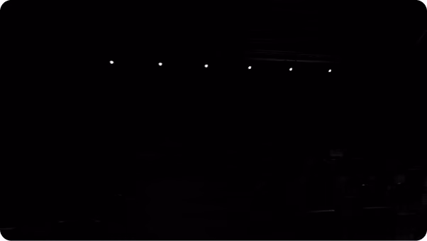Dark cinematic scene with scattered light points, from a motion graphics reel
