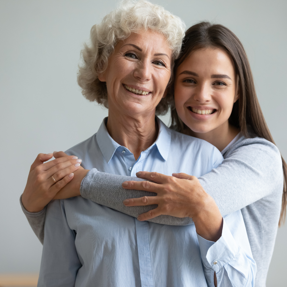 An adult daughter with her mother at home