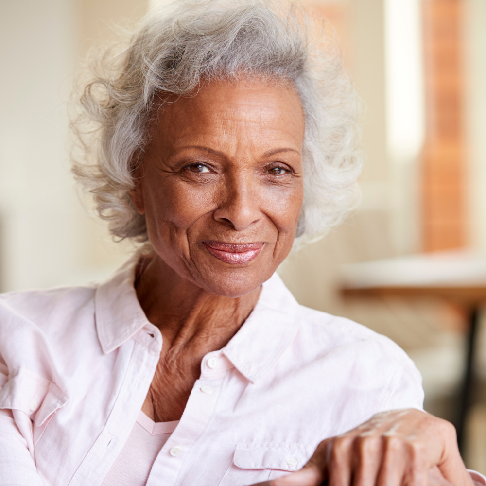 A portrait of an older woman at home
