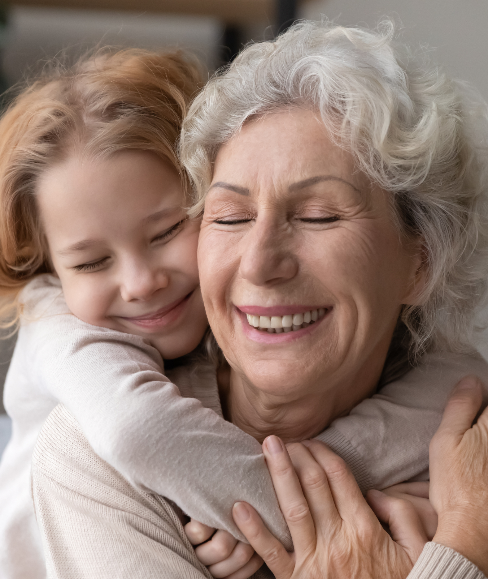 A grandmother holding her grandchild