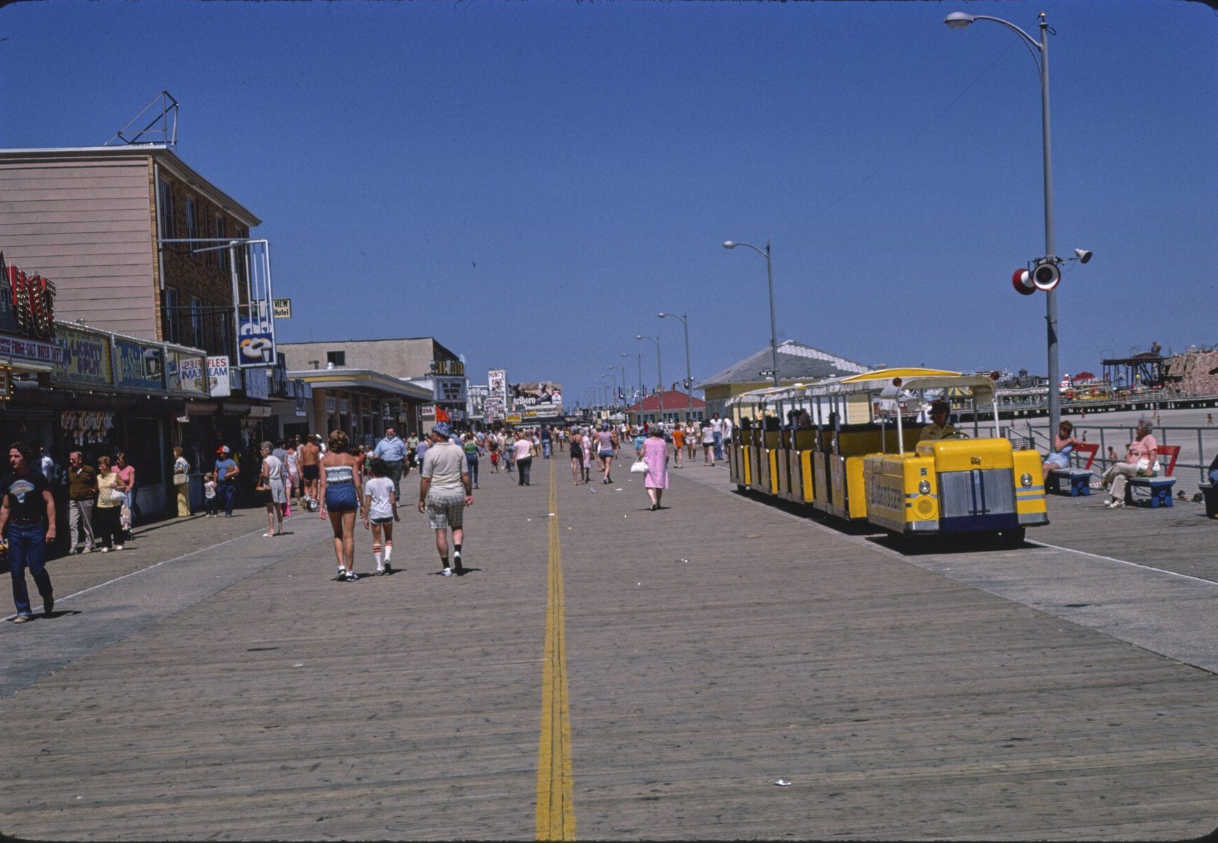 The Wildwood boardwalk with the yellow tram car