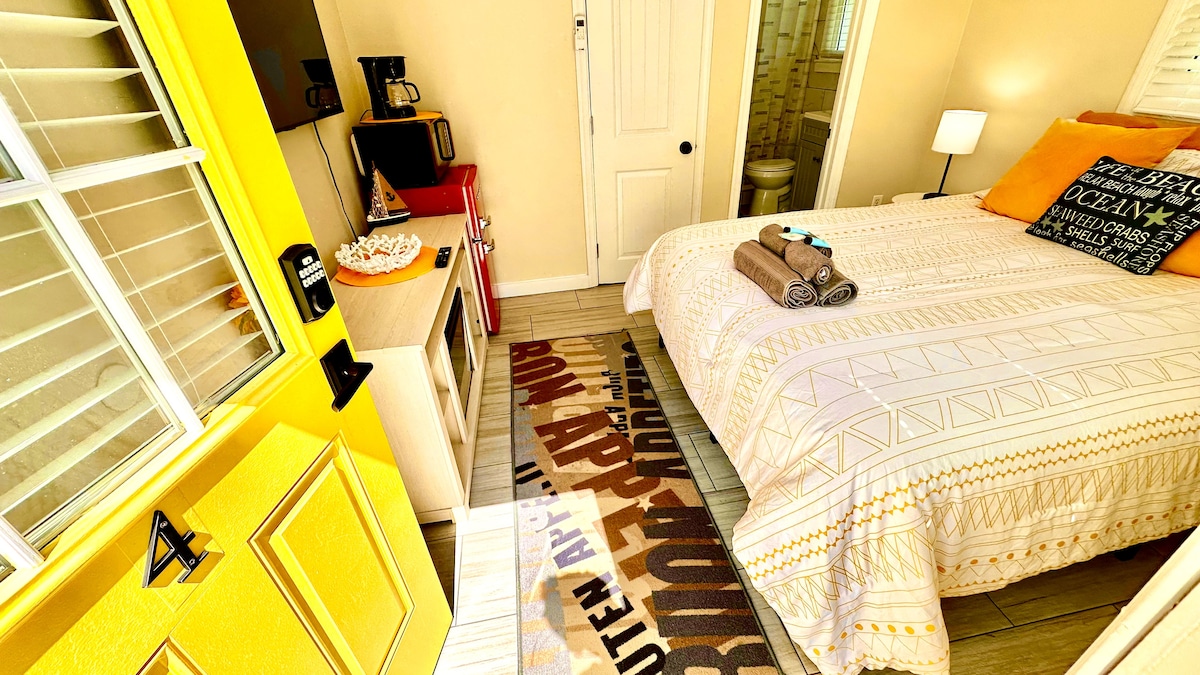 Cozy Queen Bedroom with Mini-Fridge, Drip Coffee Maker & 50" TV