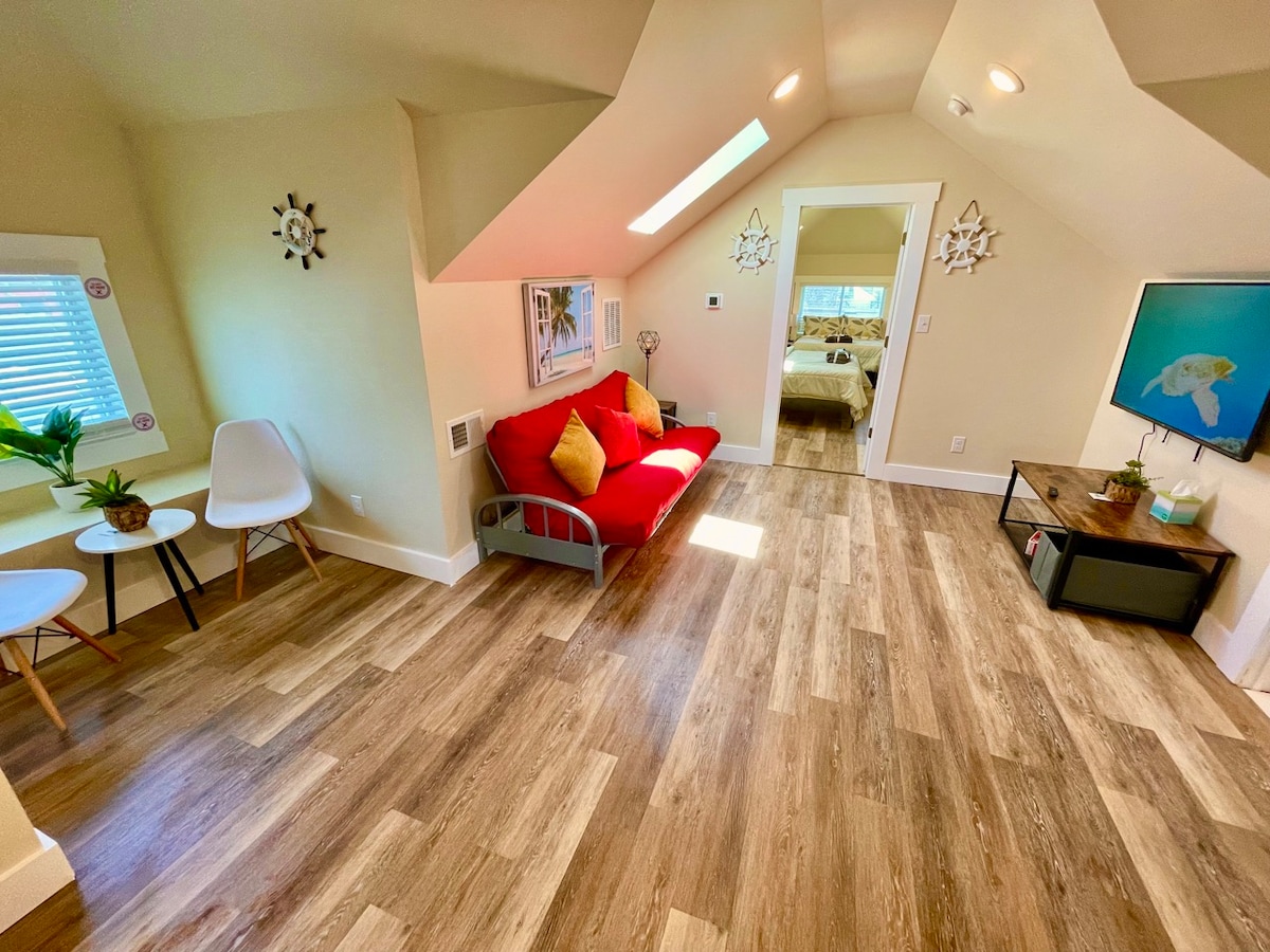 Sun-Kissed Elegance: Airy Living Space, Panoramic Sky Windows, 60" TV, & Deluxe Kitchen