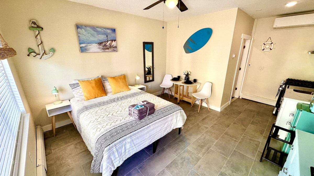 Enjoy plush bedding on a queen bed, along with a 65-inch Smart TV for entertainment. Revel in the spacious cleanliness o