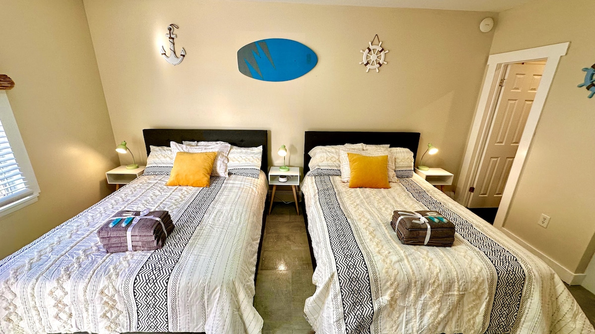 Indulge in the luxury Queen beds and the excitement of a 65-inch TV for the perfect blend of comfort and entertainment i