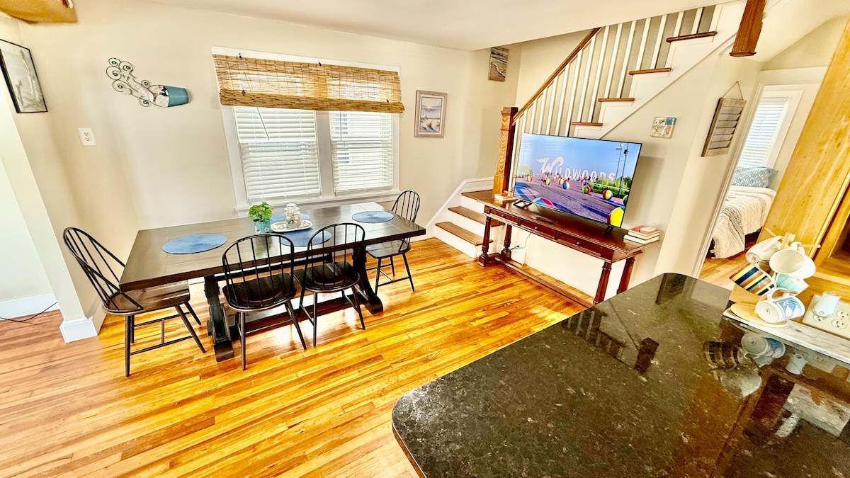 Full kitchen with a dining table, large additional dining area, and a breakfast bar—plenty of seating for everyone to ga