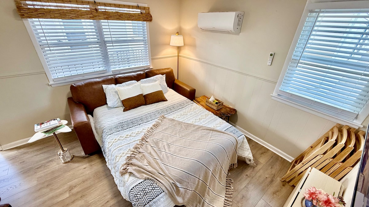 Folding couch that converts into a comfortable queen-size bed.