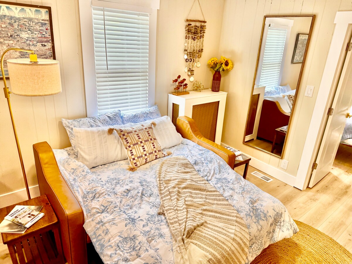 Comfortable queen-size pull-out sofa bed, perfect for additional guests and a cozy night's sleep.