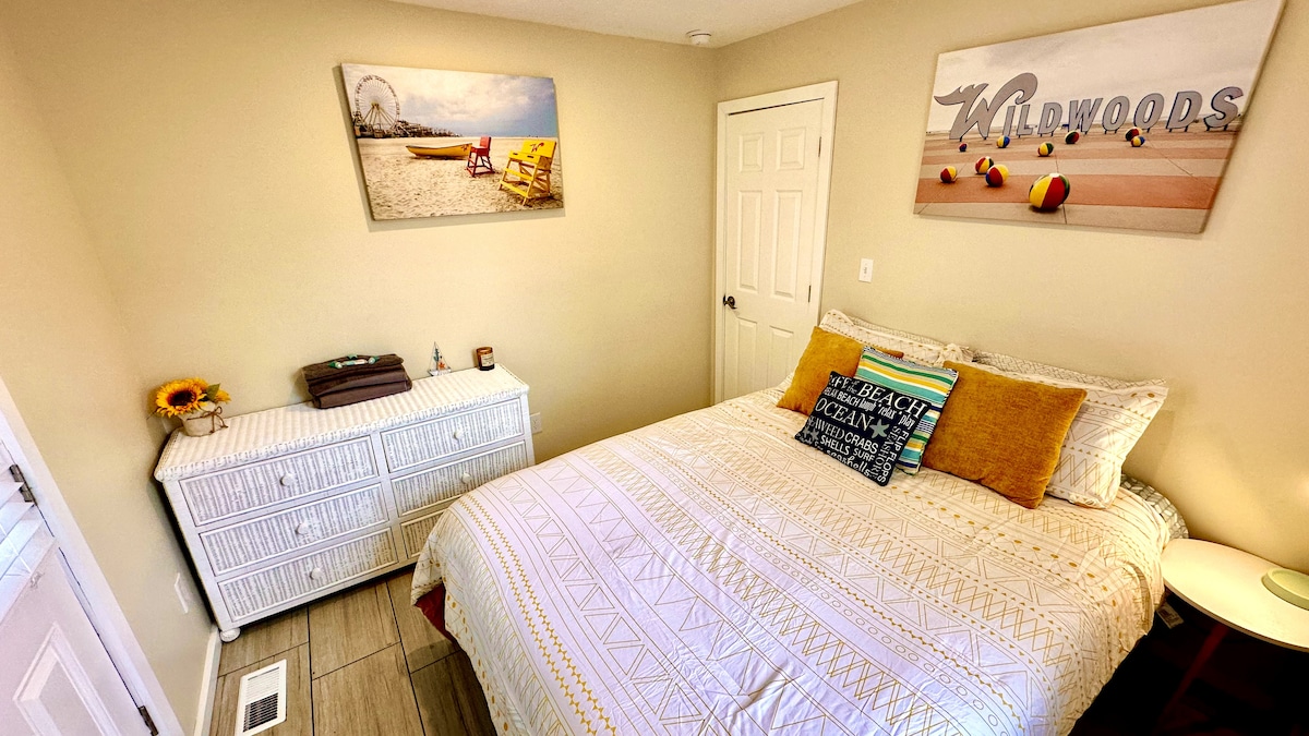 Queen bed with plush comfort, featuring access to a private porch