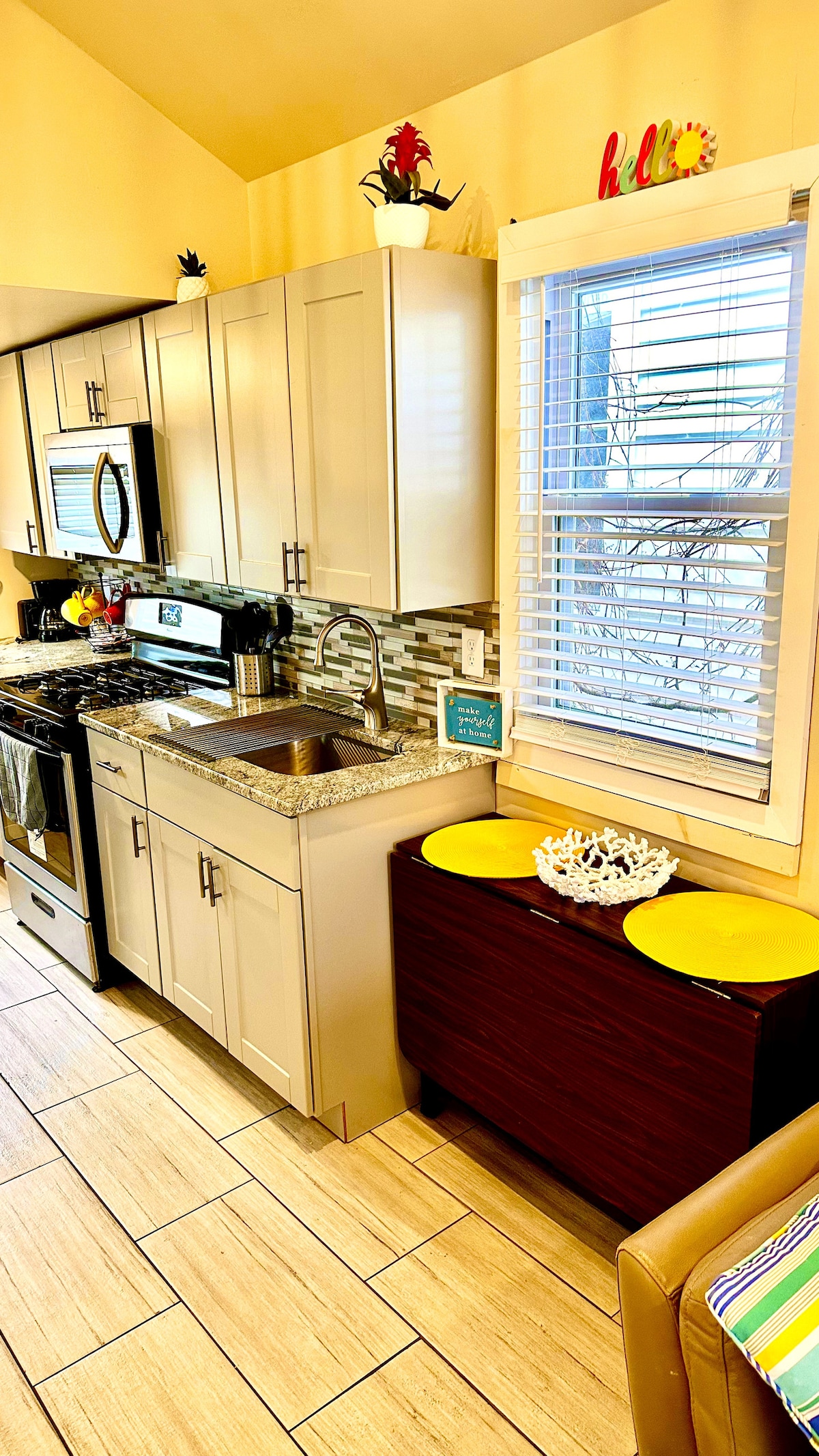 Fully-equipped kitchen with convenient, foldable table for effortless and enjoyable meal preparation and dining