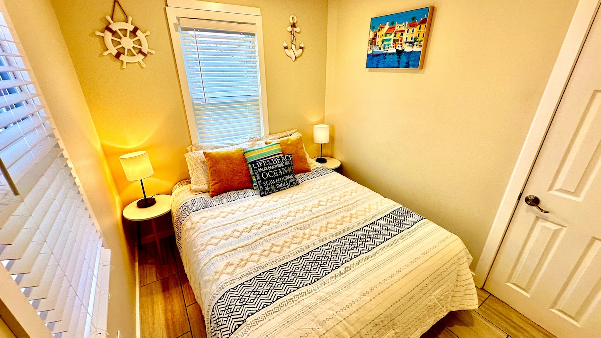 Queen-size bed with premium linens and a high-definition TV for an enhanced relaxation experience.