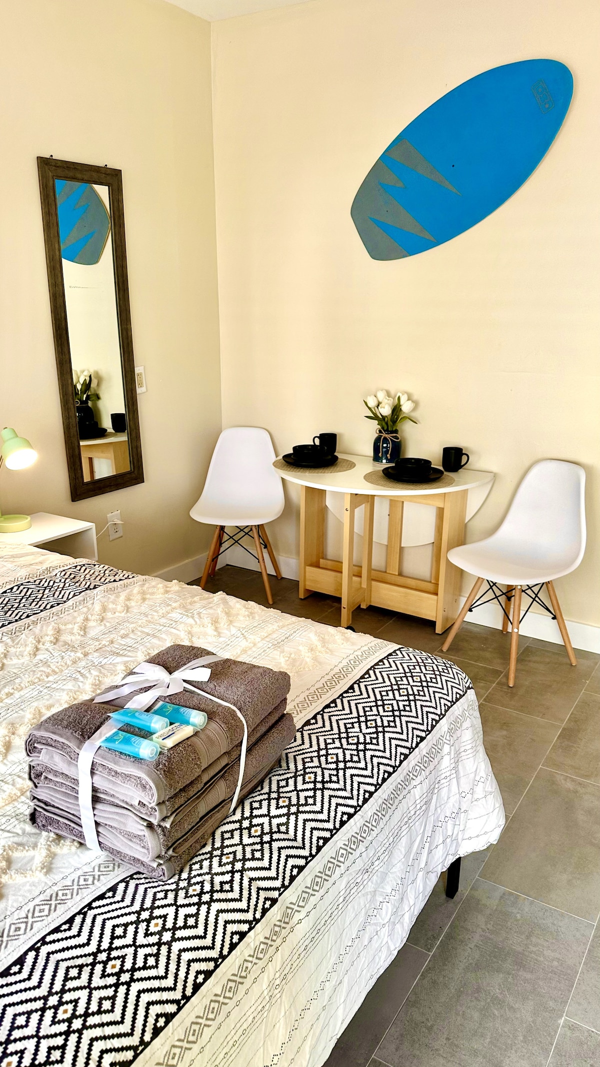 Our queen-size bed, cocooned in luxuriously soft bedsheets for a restful night's sleep. Dive into relaxation and wake up