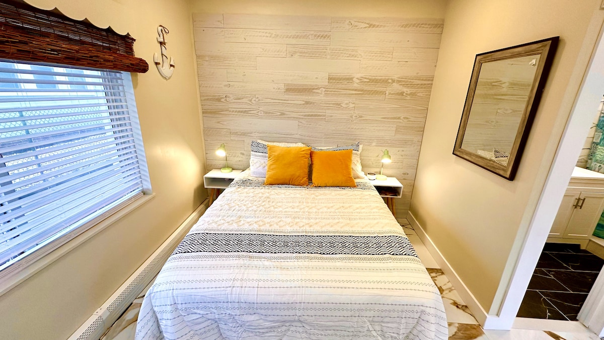 Indulge in a restful night's sleep on our luxurious queen bed, complete with high-quality, cozy bedding