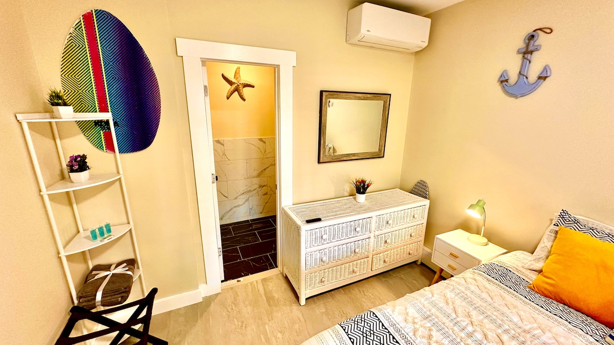 Our cozy space is thoughtfully equipped with a compact fridge, toaster, and drip coffee maker, complemented by a versati