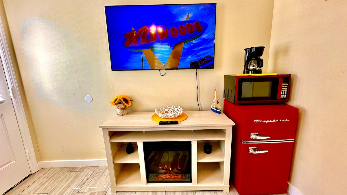 Cozy Queen Bedroom with Mini-Fridge, Drip Coffee Maker & 50" TV