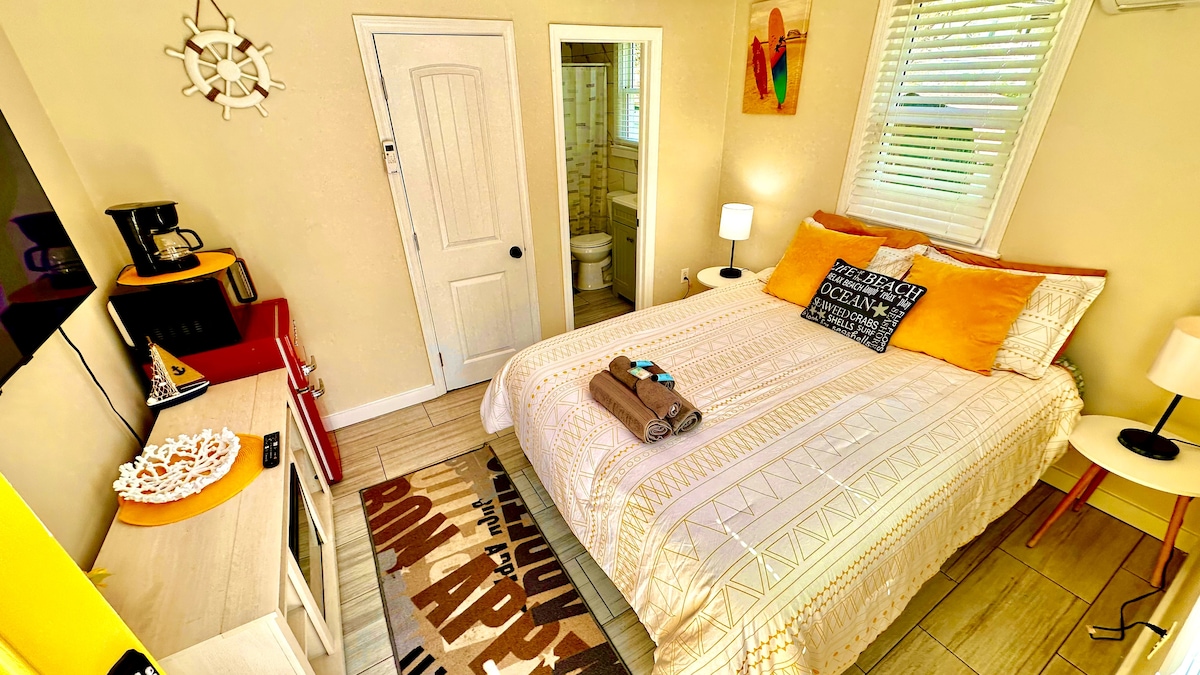 Cozy Queen Bedroom with Mini-Fridge, Drip Coffee Maker & 50" TV