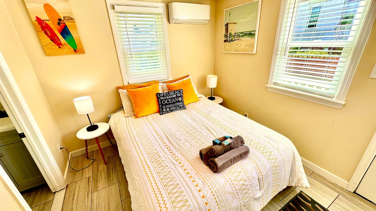 Cozy Queen Bedroom with Mini-Fridge, Drip Coffee Maker & 50" TV