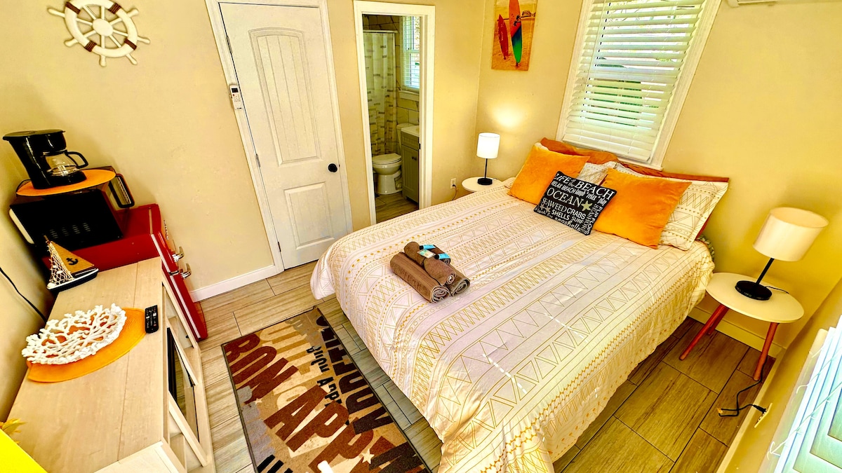 Cozy Queen Bedroom with Mini-Fridge, Drip Coffee Maker & 50" TV