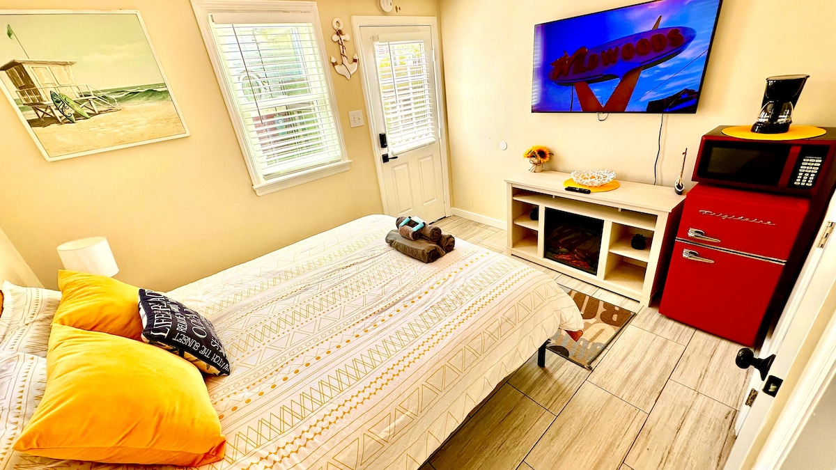 Cozy Queen Bedroom with Mini-Fridge, Drip Coffee Maker & 50" TV