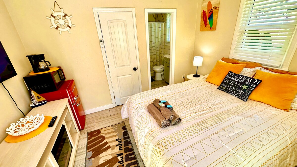 Cozy Queen Bedroom with Mini-Fridge, Drip Coffee Maker & 50" TV