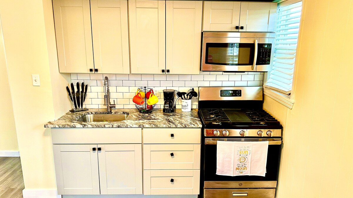 A complete kitchen paired with an elegant dining space, creating a harmonious space for cooking and dining in style