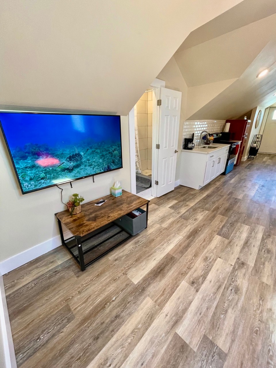 Sun-Kissed Elegance: Airy Living Space, Panoramic Sky Windows, 60" TV, & Deluxe Kitchen