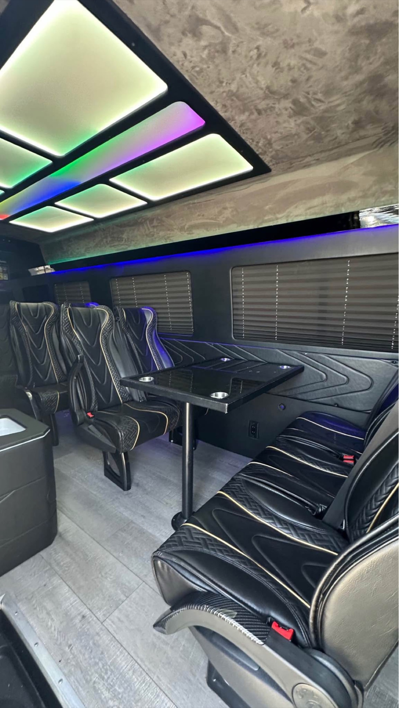 Executive party bus seating and table with cup holders