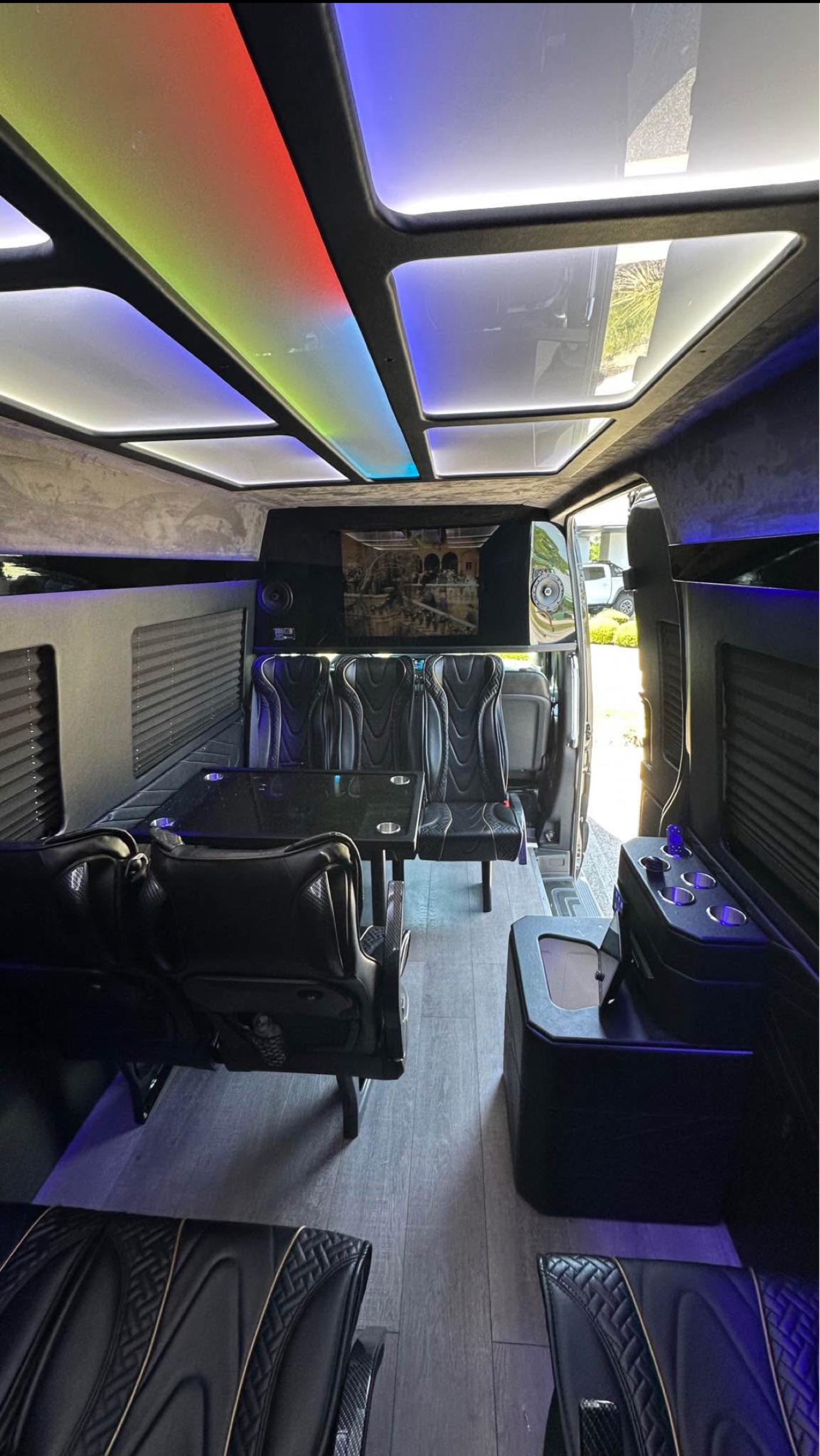Executive Sprinter interior with custom lighting for private Asheville brewery and winery transportation