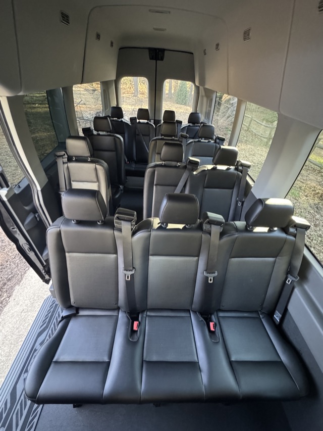 Interior seating in an Appalachian Motorcoach Ford Transit wedding shuttle
