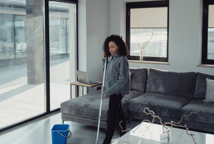 Instagram post: suited Dustora cleaners vacuuming a living room