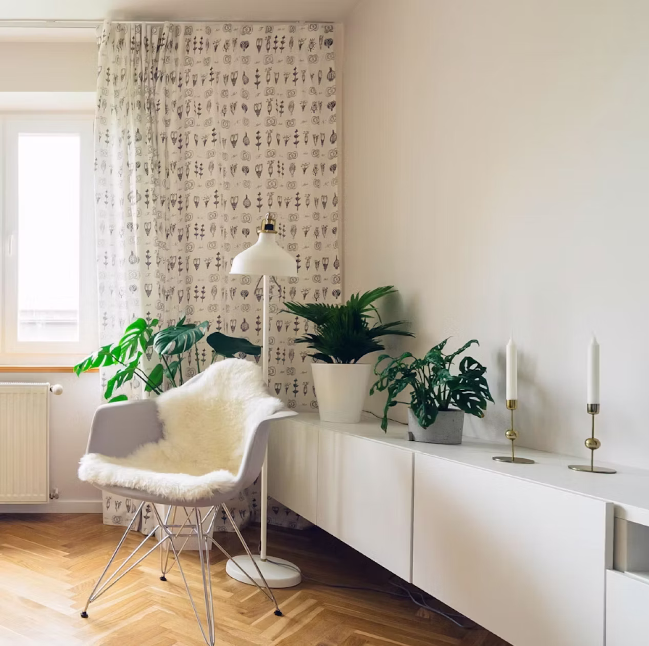 Styled living room with mantel, shelving, and soft window light after a Dustora clean