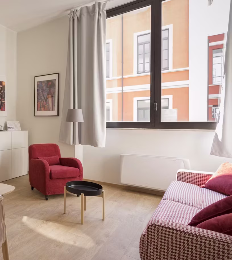Cosy living room with a red armchair
