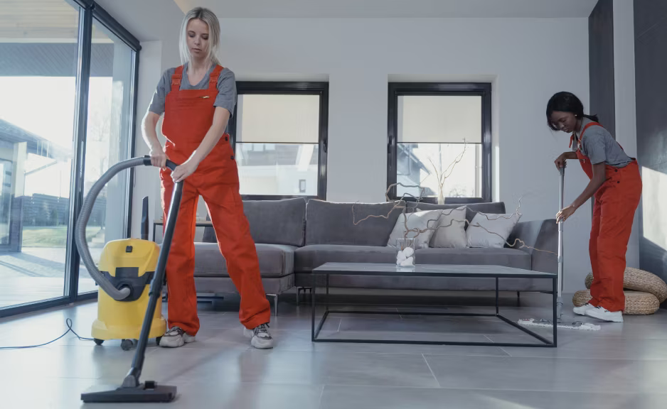 Cleaning team maintaining an office dining area