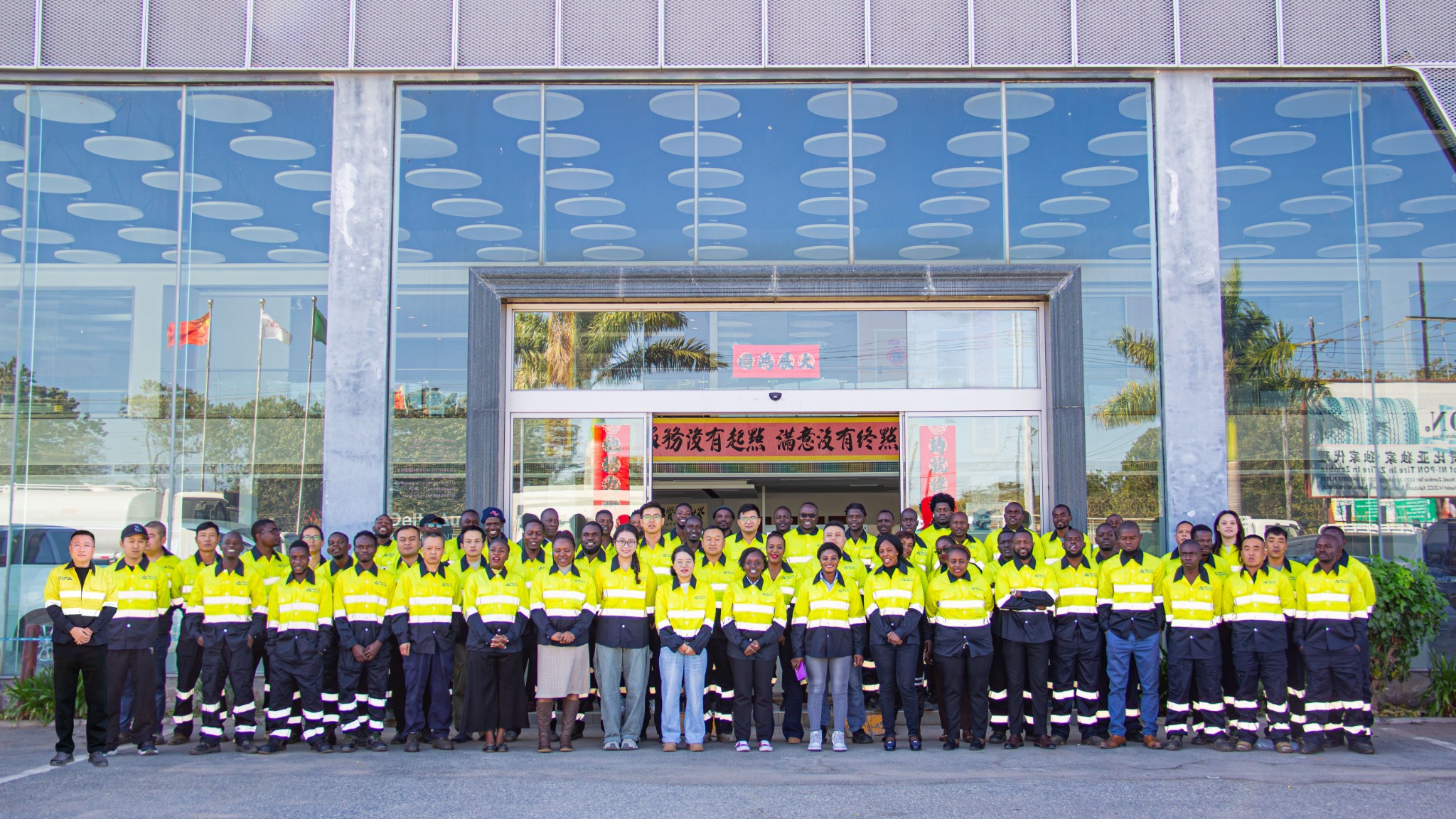 The Delta Auto team gathered outside the company office