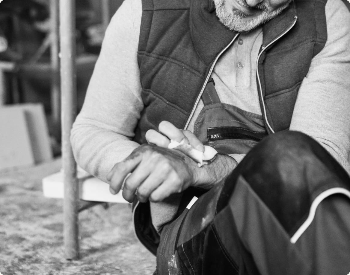 A worker holding an injured hand