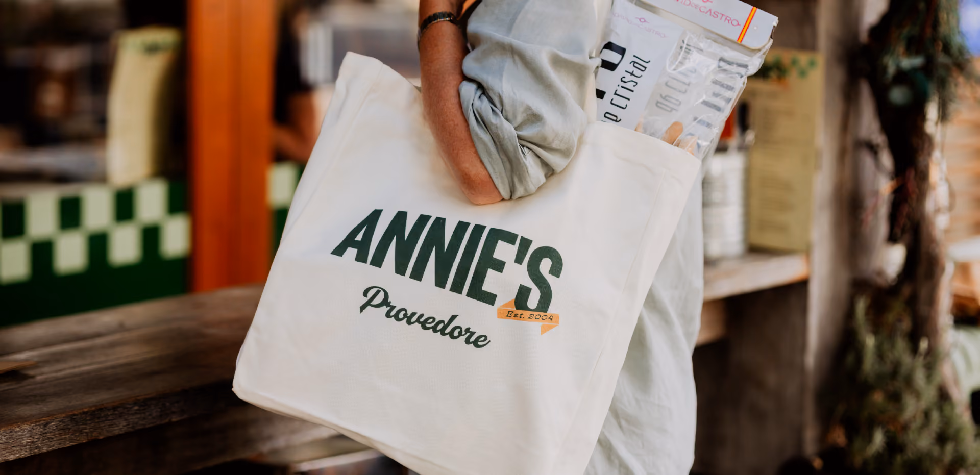 Annie's Provedore tote bag over the shoulder of customer