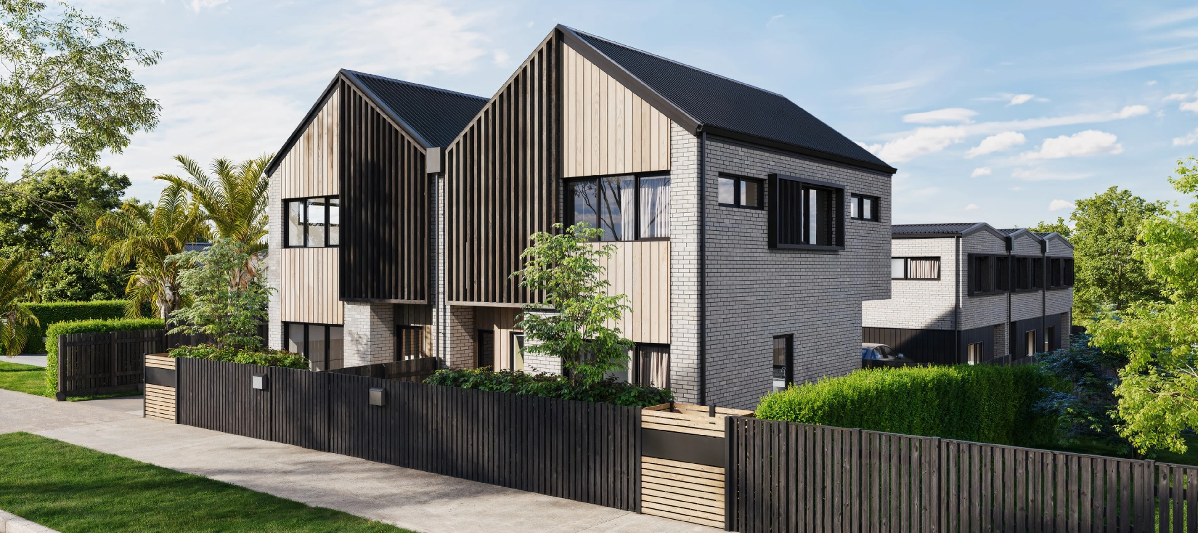 Eden Group townhouses at 9 Kesteven Avenue, Glendowie, showing the brick, feature cedar and weatherboard exterior.